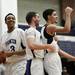 The Pioneer team celebrates after defeating Saline 58-53 on Friday, Feb. 1. Daniel Brenner I AnnArbor.com
